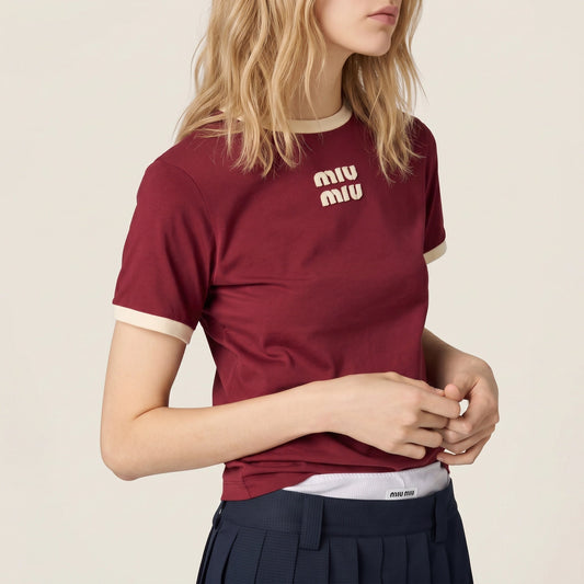 Miu Miu logo cotton t-shirt in burgundy, chest logo detail on model — The Quiet Edition