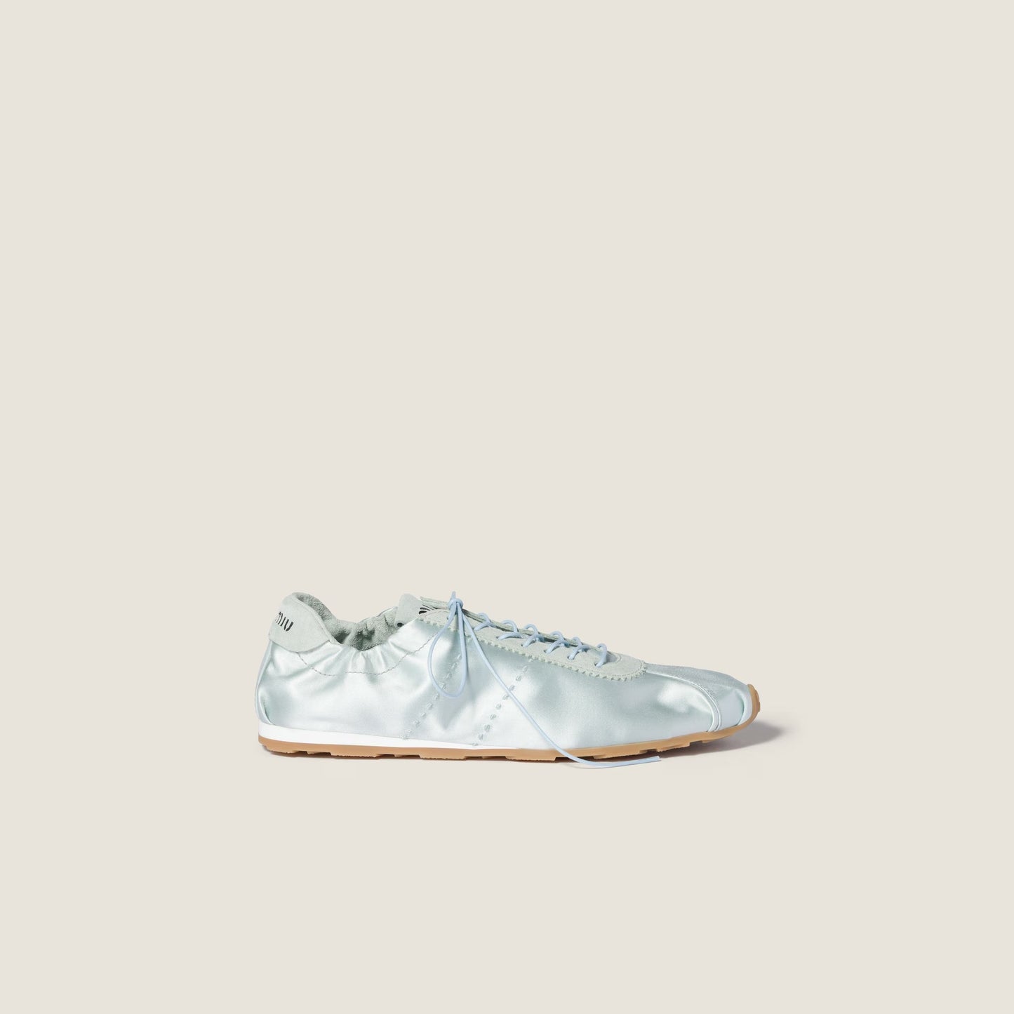 Miu Miu Plume satin sneaker in powder blue, side view — The Quiet Edition