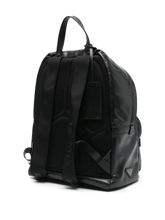 Prada leather backpack in black, back view with padded straps and mesh panel — The Quiet Edition