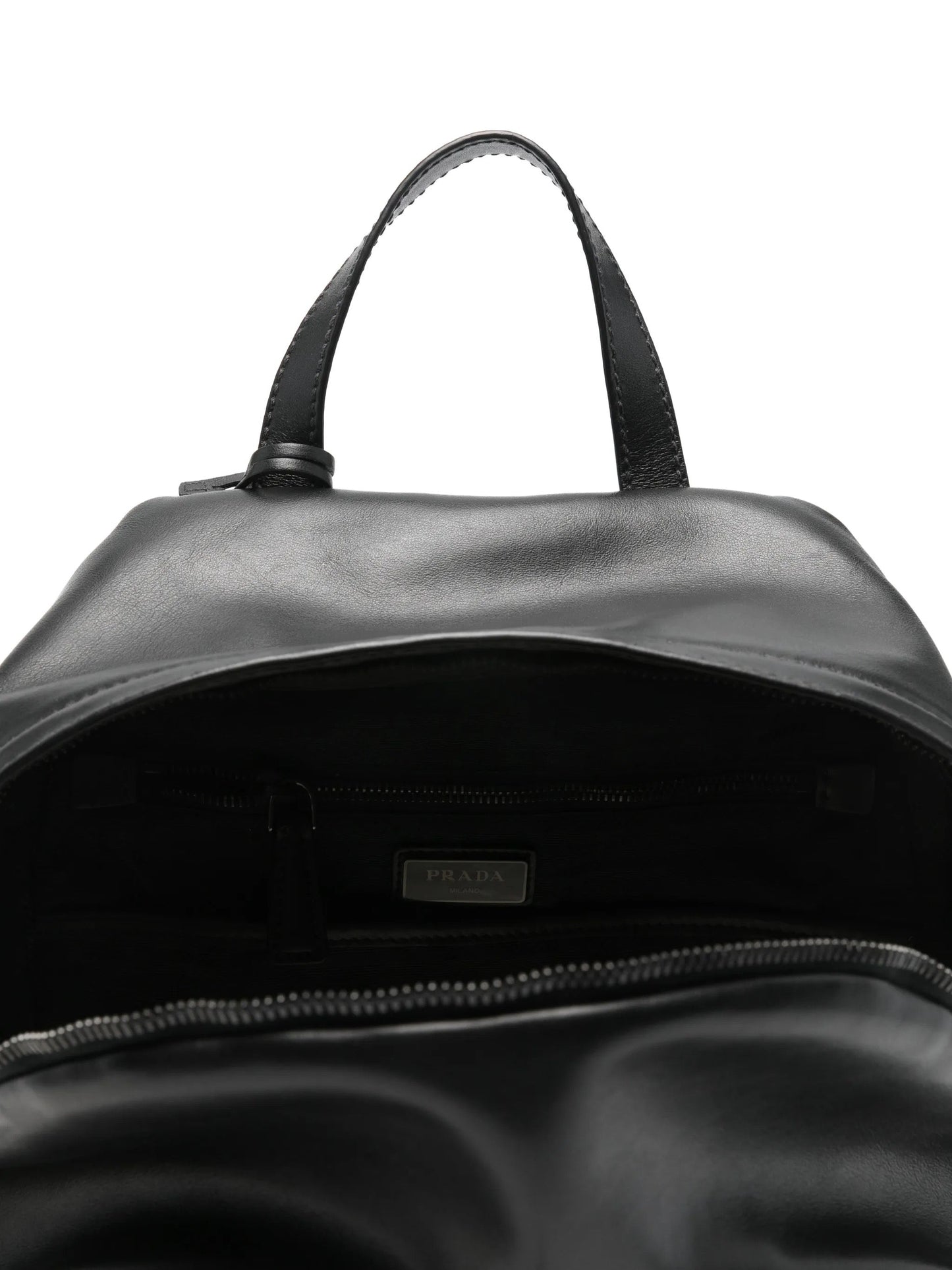 Prada leather backpack in black, interior with Prada Milano label — The Quiet Edition
