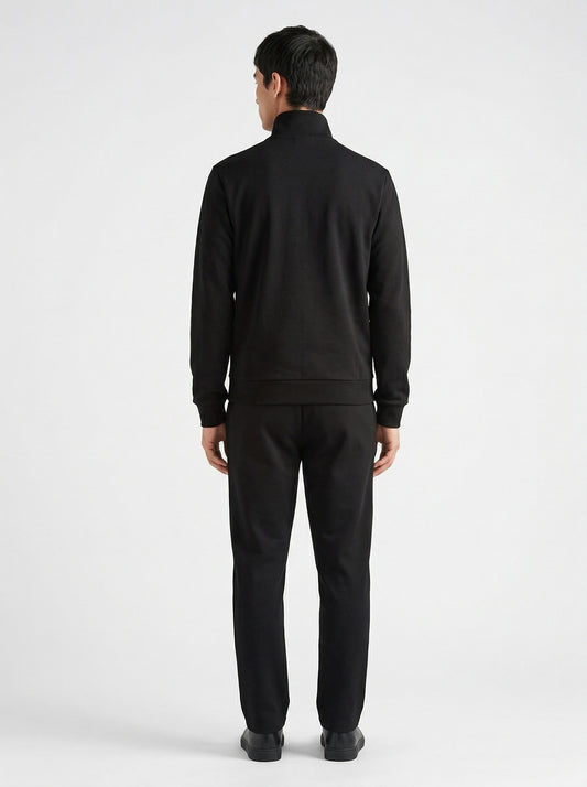 Prada logo patch zip cardigan in black, model back — The Quiet Edition