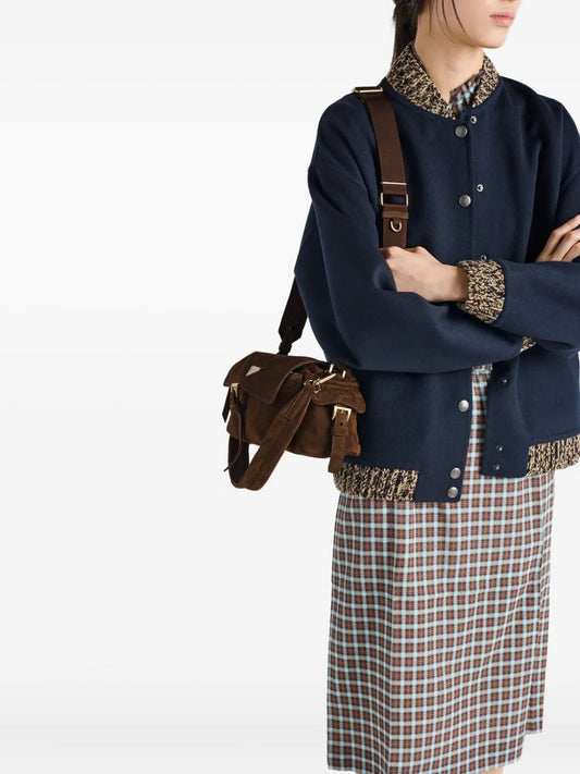 Prada Medium Explore shoulder bag in brown, model crossbody view — The Quiet Edition