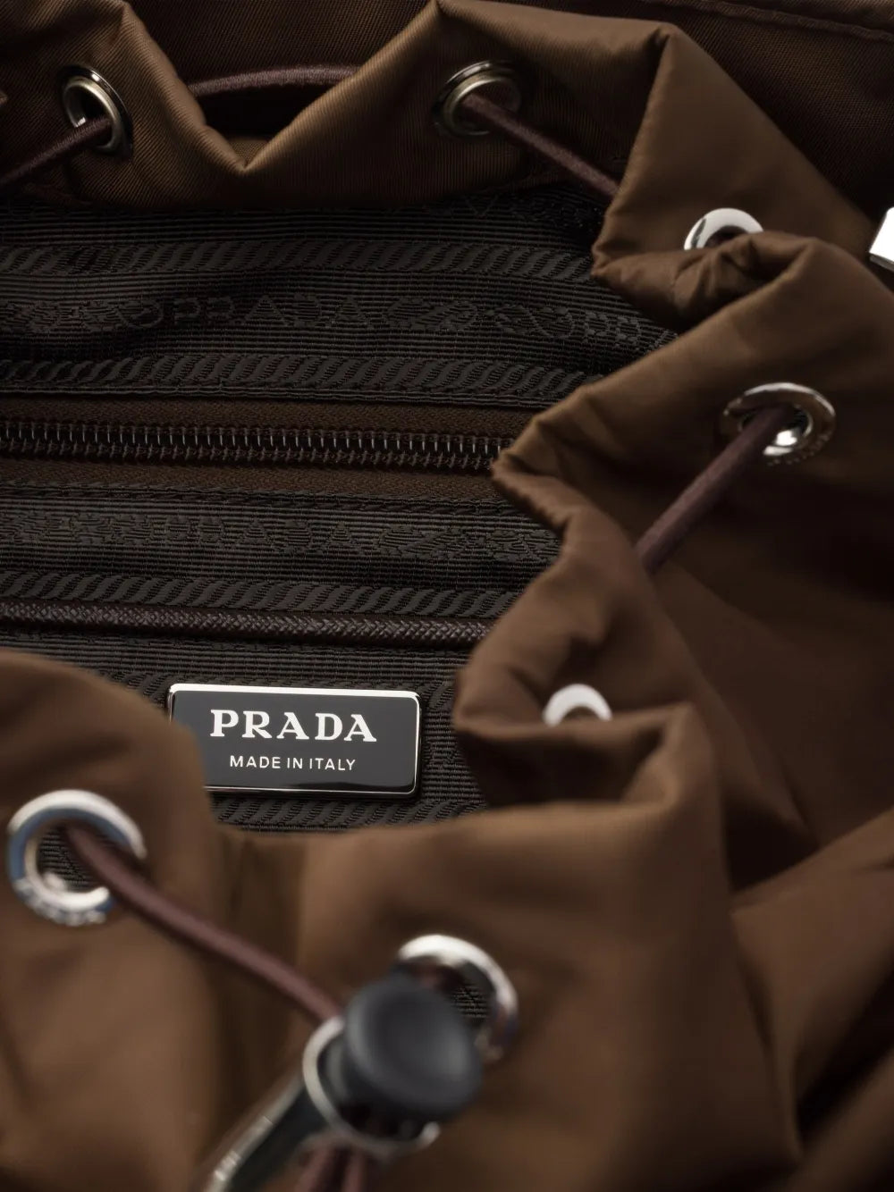 Prada Re-Nylon Backpack in Brown, detail — The Quiet Edition