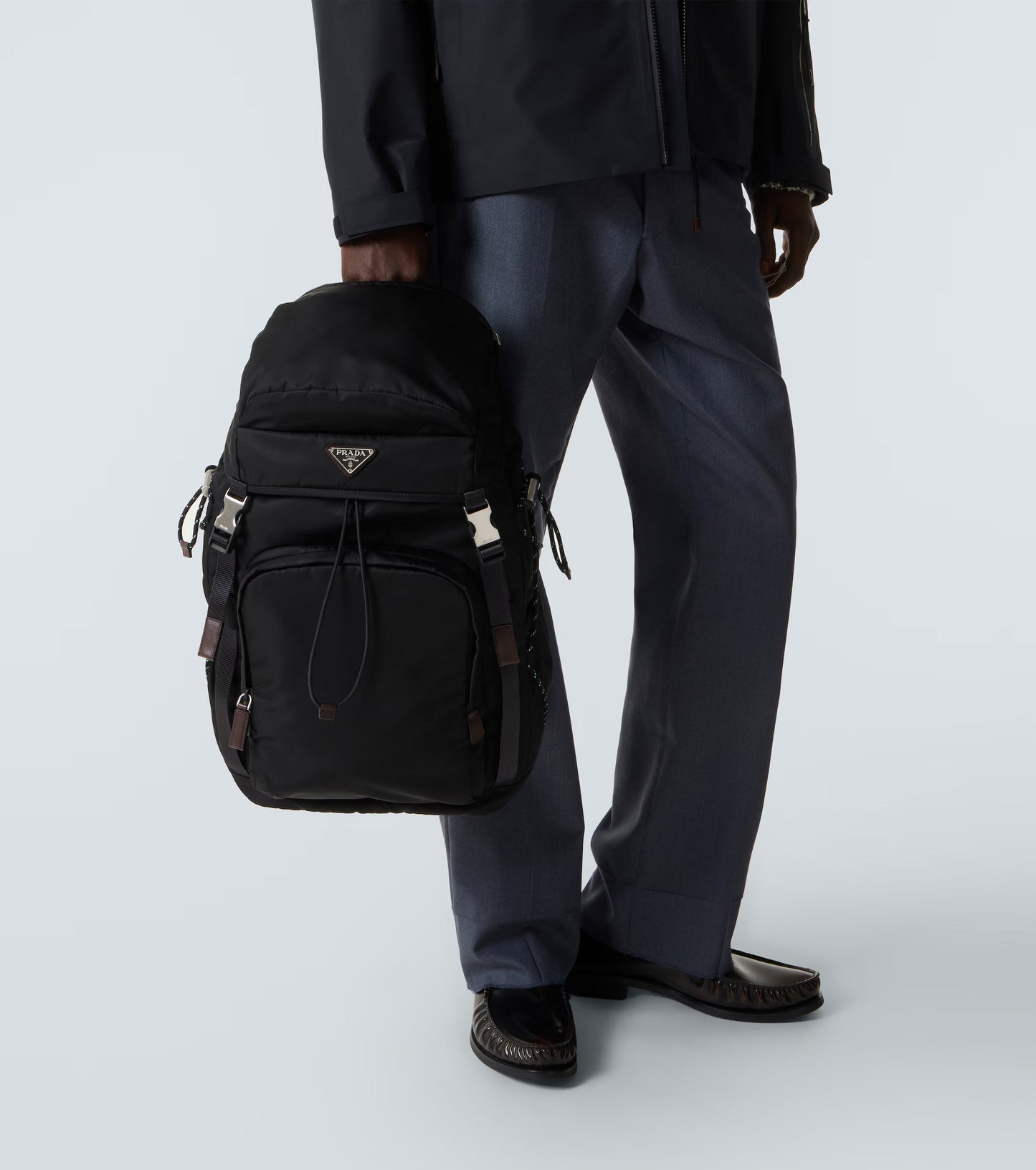 Prada Speedrock Re-Nylon backpack in black, model close-up — The Quiet Edition