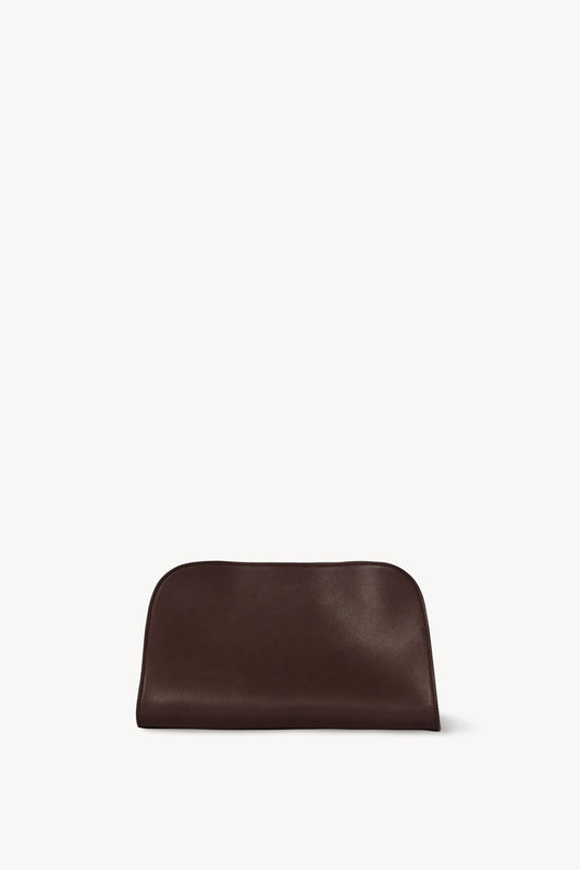 The Row Peggy Clutch in Burgundy, front — The Quiet Edition