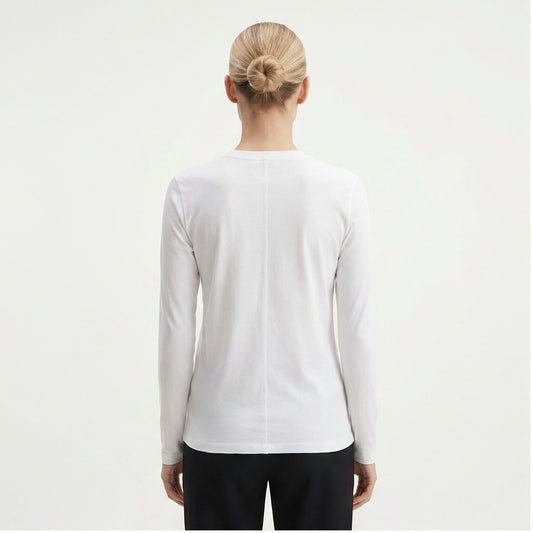 The Row Sherman long-sleeve t-shirt in white, back view on model — The Quiet Edition