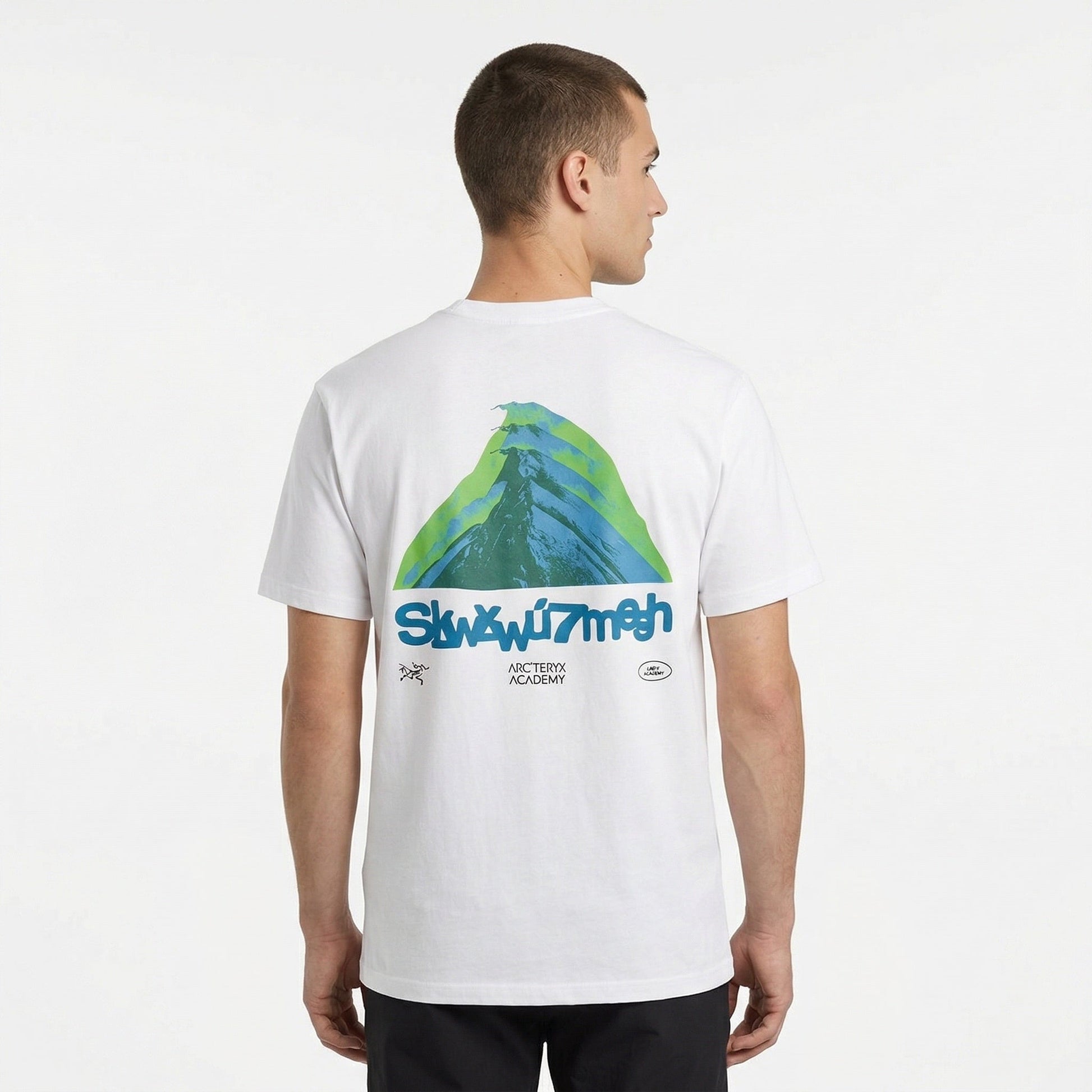 Arc'teryx graphic logo t-shirt in white, model back view — The Quiet Edition