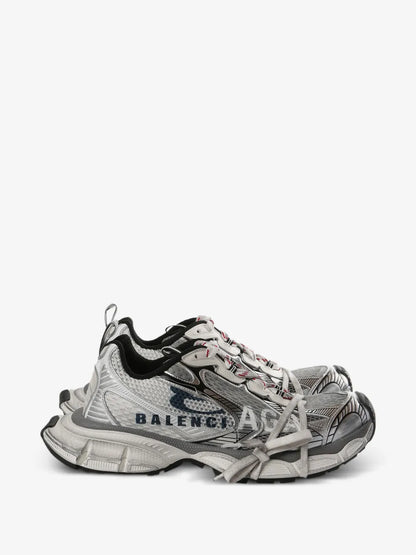 Balenciaga 3XL Split Logo Sneakers in white, side profile showing the split Balenciaga print and worn-effect sole