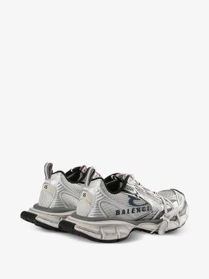 Balenciaga 3XL Split Logo Sneakers, rear three-quarter view of the pair showing the heel pull tabs and black sole