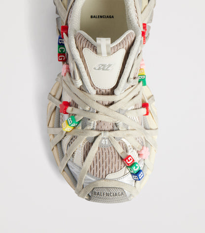 Balenciaga Distressed 3XL Extreme Lace Sneaker top view with criss-cross laces and BCG bead charms