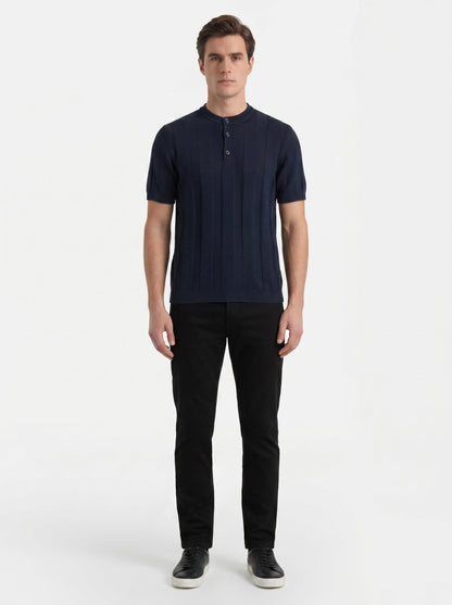 Brunello Cucinelli linen-blend knit t-shirt in navy, model front — The Quiet Edition