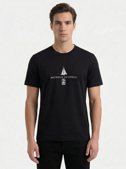 Brunello Cucinelli logo print t-shirt in black, model front — The Quiet Edition