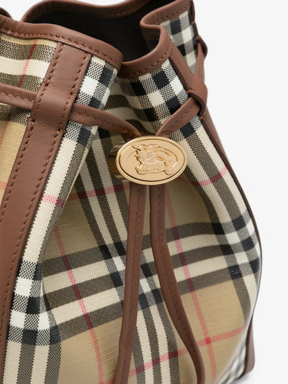 Burberry Small Check Bucket Bag detail of the gold Equestrian Knight medallion and drawstring cords