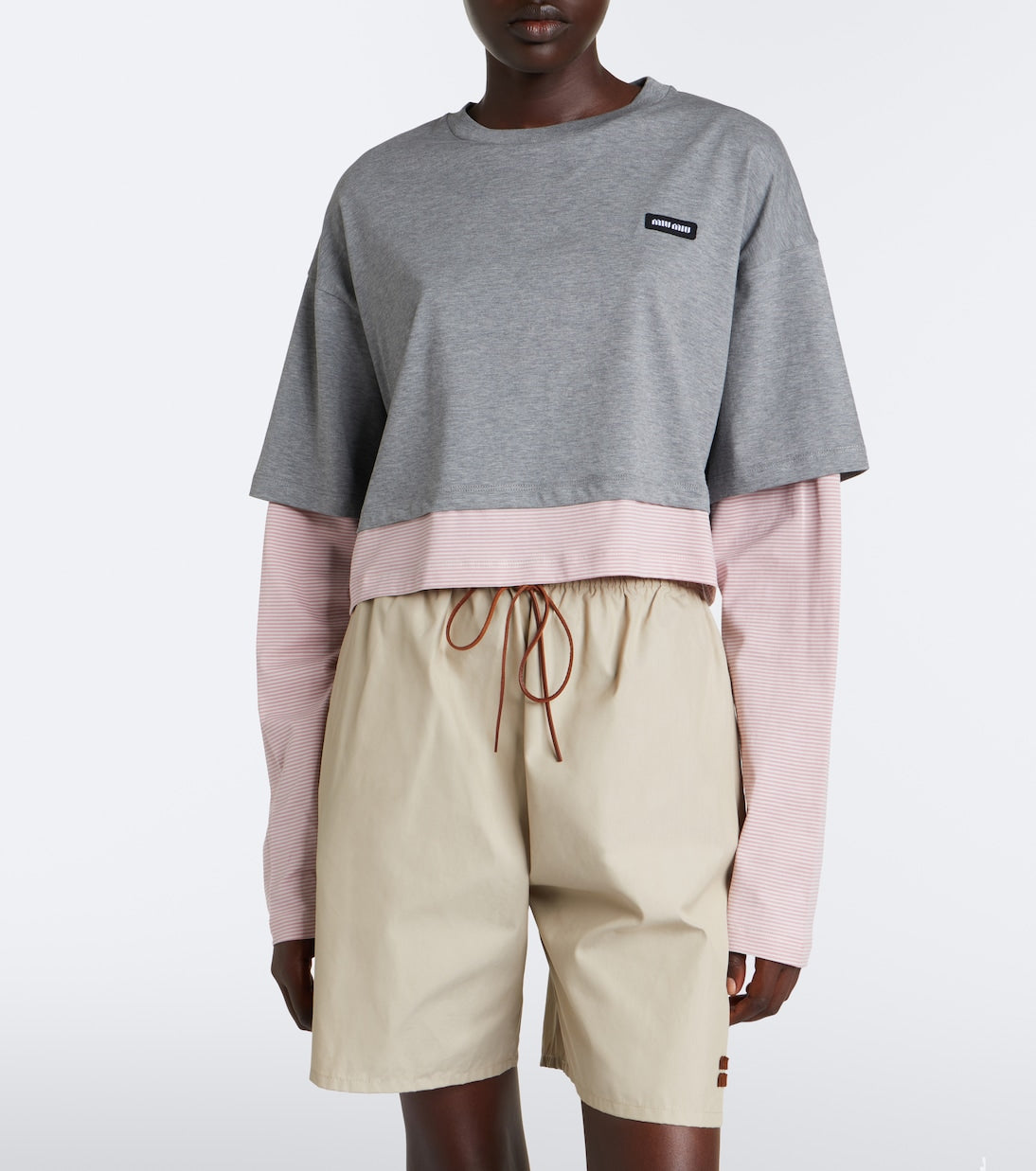 Miu Miu layered cotton jersey T-shirt in grey worn front view with beige shorts