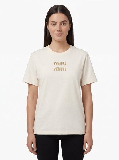 Miu Miu embroidered logo t-shirt in white, model front — The Quiet Edition