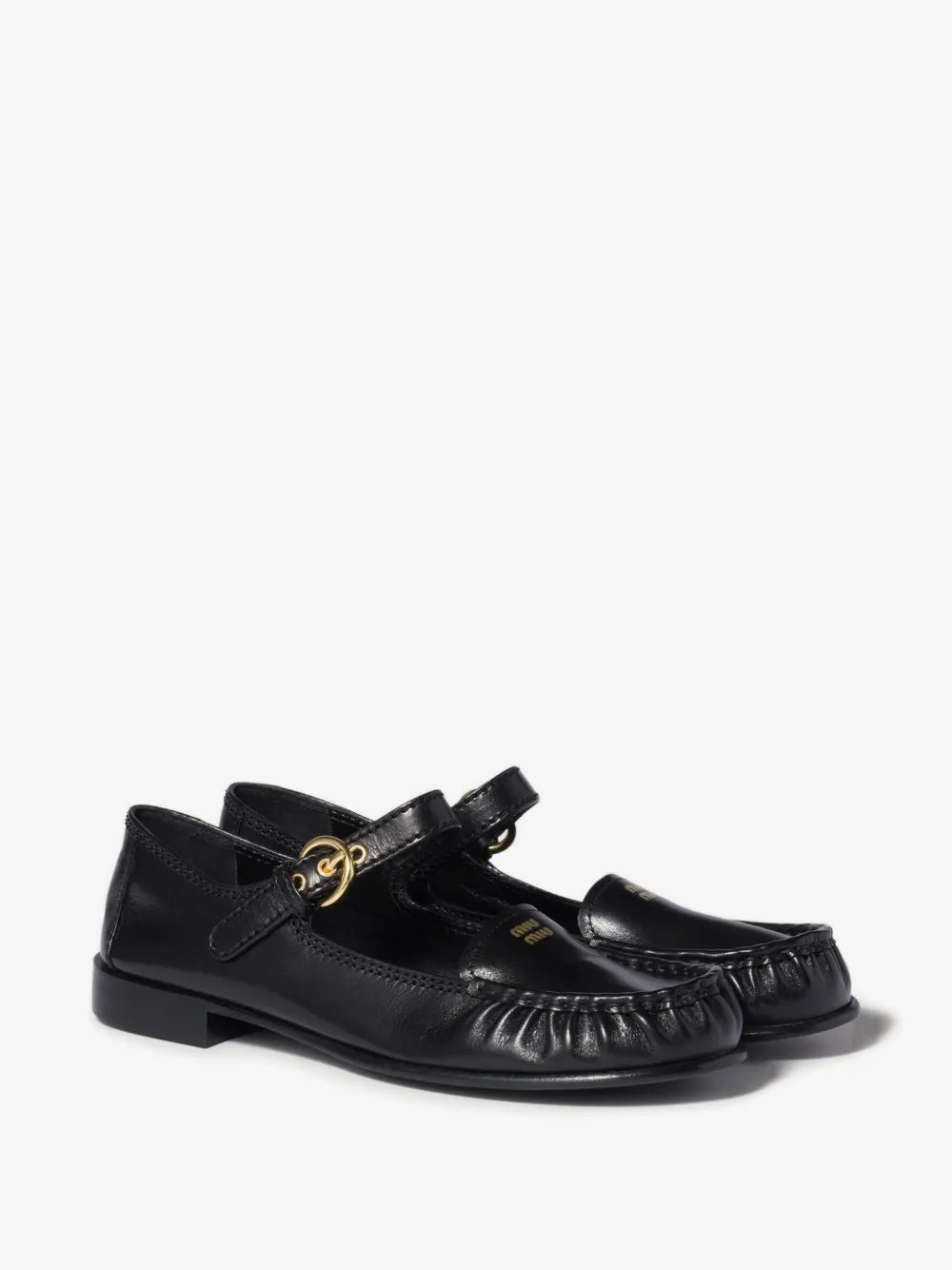 Miu Miu Leather Loafers with Strap in Black, three-quarter angle view of the pair — The Quiet Edition