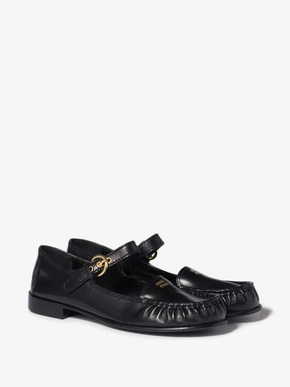 Miu Miu Leather Loafers with Strap in Black, three-quarter angle view of the pair — The Quiet Edition