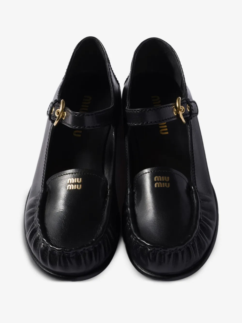 Miu Miu Leather Loafers with Strap in Black, top view of the pair — The Quiet Edition
