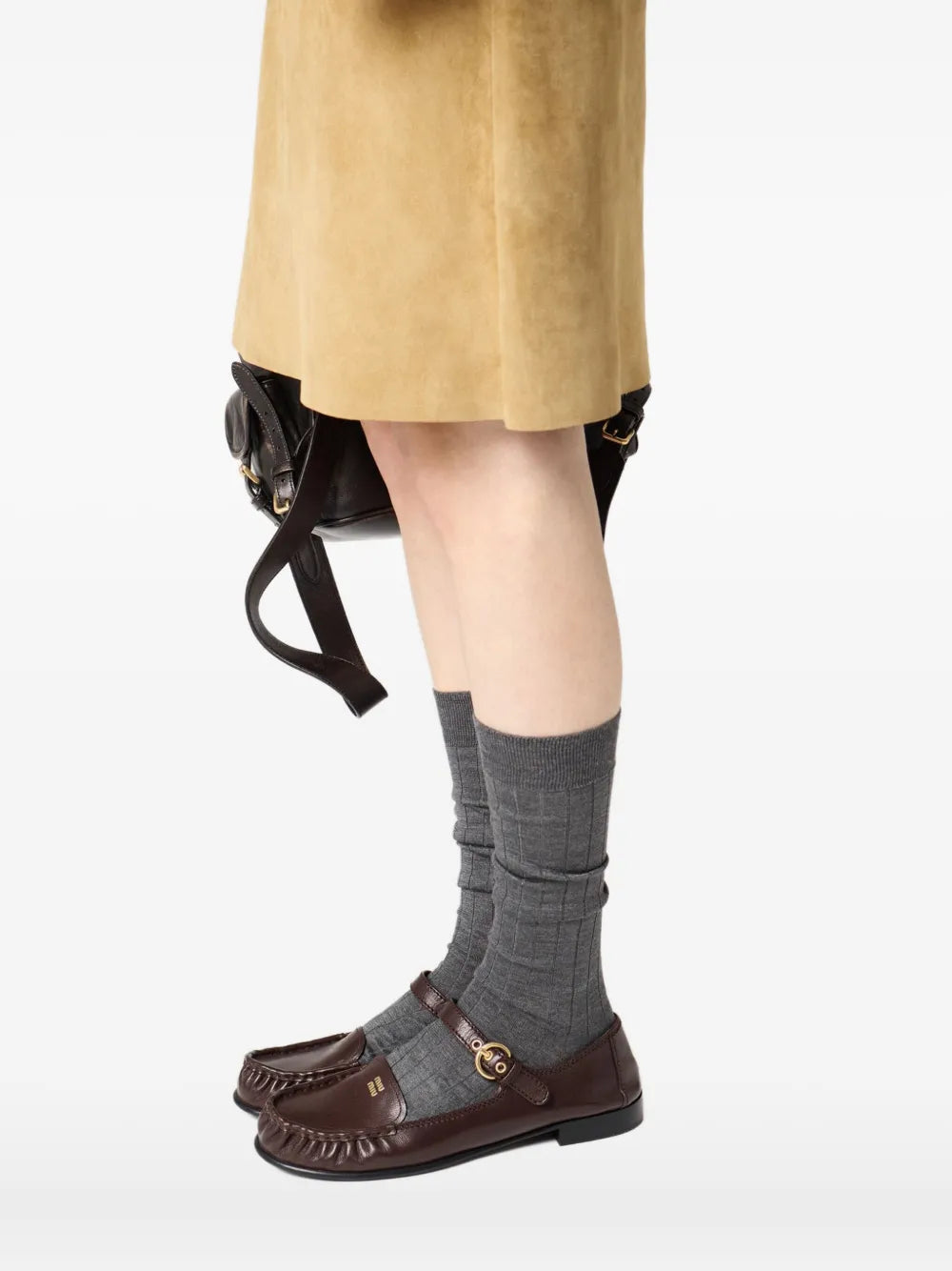Miu Miu Leather Loafers with Strap in Brown, worn view with socks — The Quiet Edition