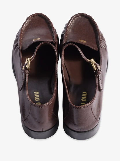 Miu Miu Leather Loafers with Strap in Brown, back view of the pair — The Quiet Edition