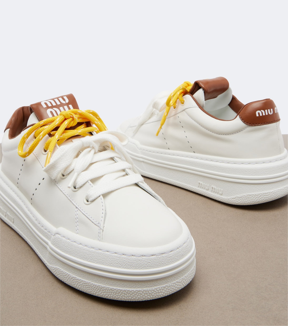 Miu Miu Leather Platform Sneakers in White, interior — The Quiet Edition