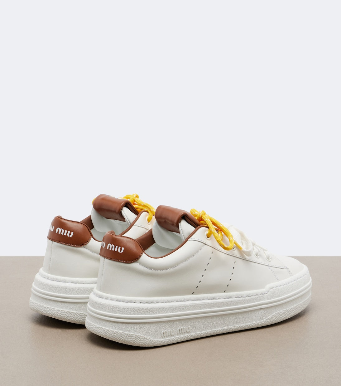 Miu Miu Leather Platform Sneakers in White, side — The Quiet Edition
