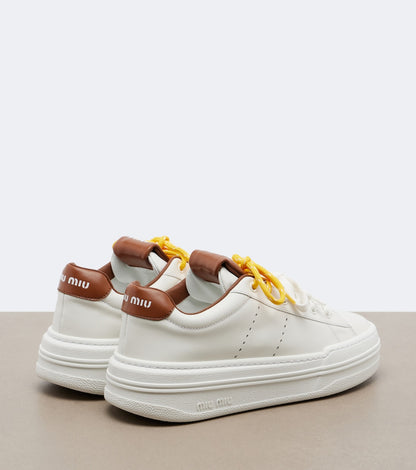 Miu Miu Leather Platform Sneakers in White, side — The Quiet Edition