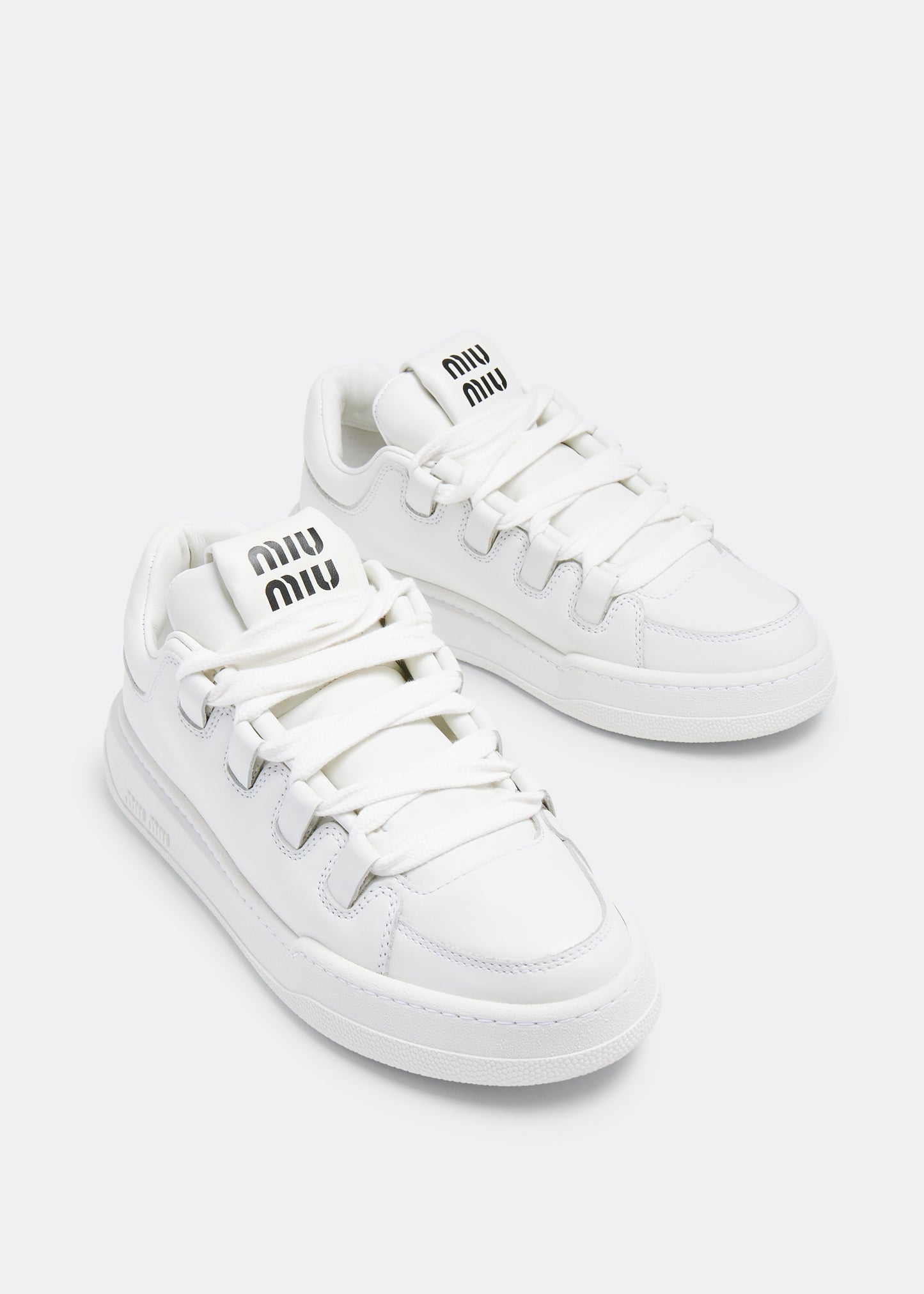 Miu Miu Leather Sneakers in White, angle — The Quiet Edition