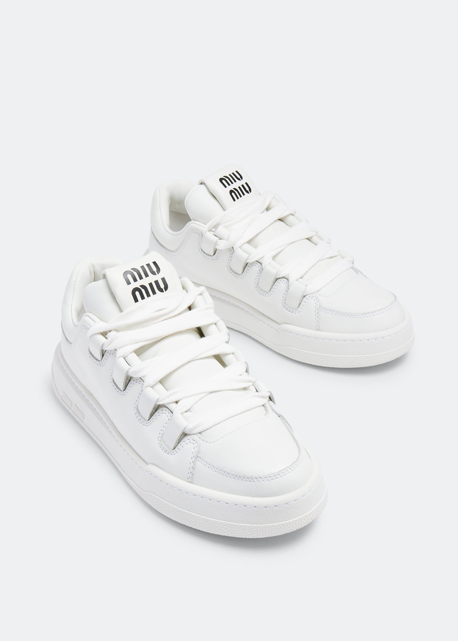 Miu Miu Leather Sneakers in White, angle — The Quiet Edition