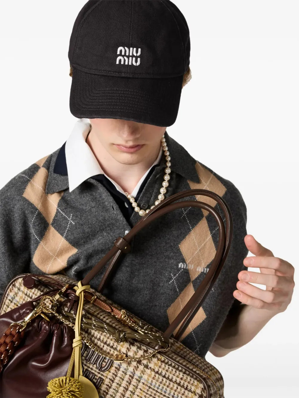 Miu Miu Logo-Embroidered Drawstring Baseball Cap in Black, side — The Quiet Edition