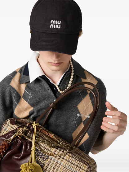 Miu Miu Logo-Embroidered Drawstring Baseball Cap in Black, side — The Quiet Edition