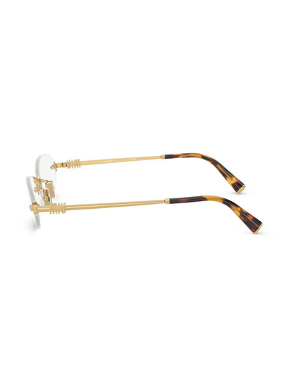 Miu Miu Oval Rimless Glasses in Gold, side — The Quiet Edition