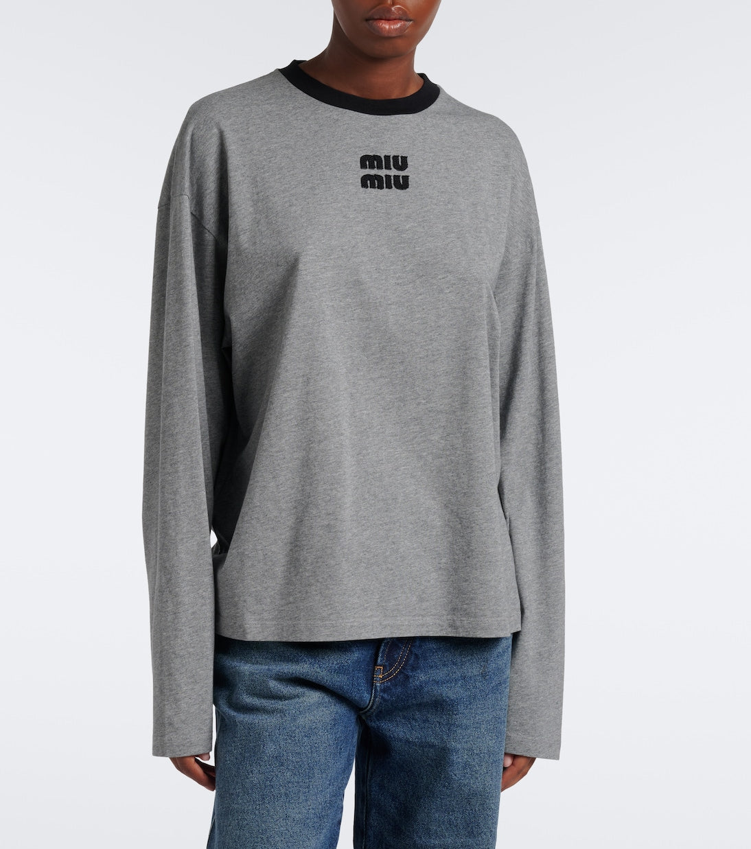 Miu Miu Oversized Cotton Jersey T-Shirt in grey on a model, front view showing the dropped shoulders