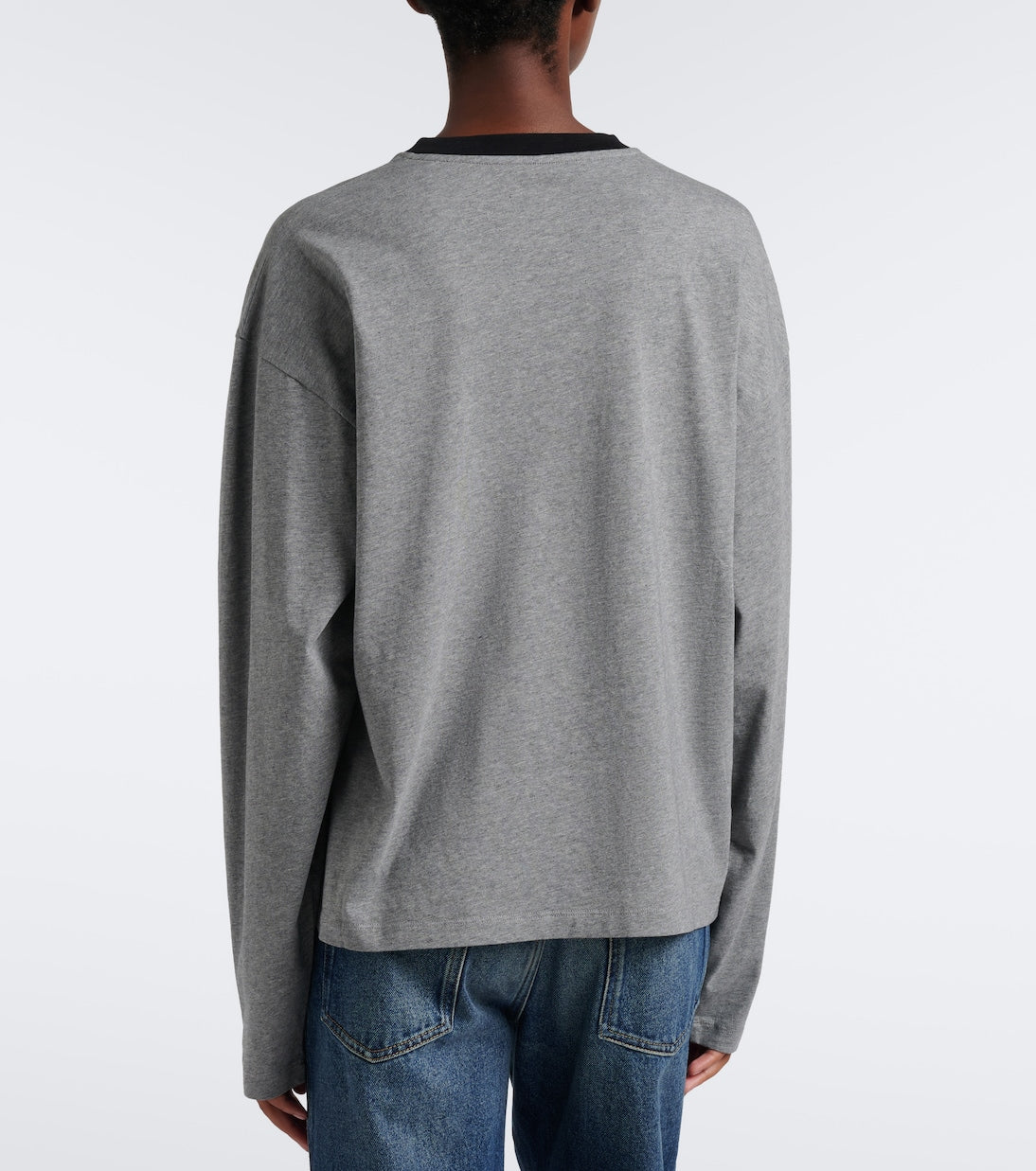 Miu Miu Oversized Cotton Jersey T-Shirt in grey, back view on a model showing the plain boxy back