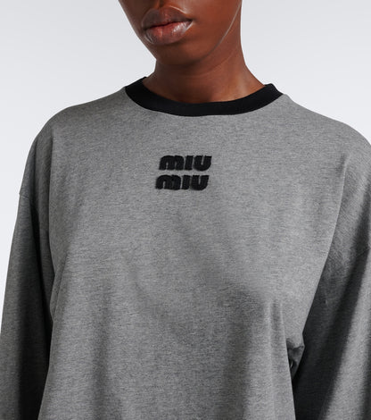 Miu Miu Oversized Cotton Jersey T-Shirt in grey, close view of the black crewneck and chest logo