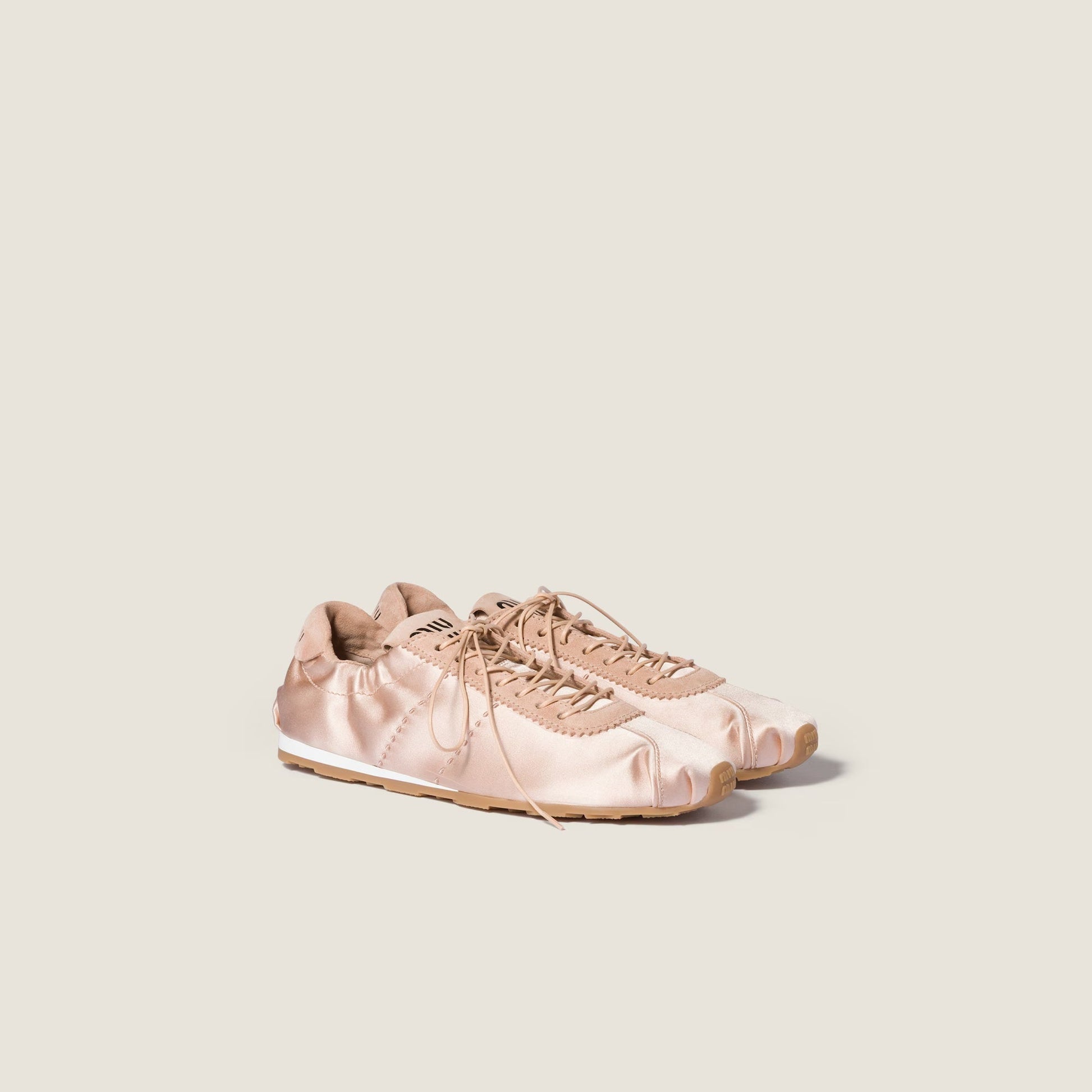 Miu Miu Plume satin sneaker in powder pink, angle view — The Quiet Edition