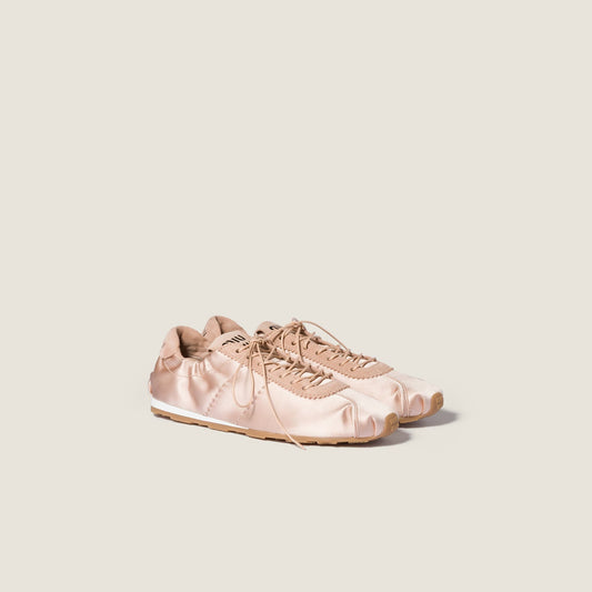 Miu Miu Plume satin sneaker in powder pink, angle view — The Quiet Edition