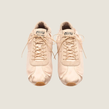 Miu Miu Plume satin sneaker in powder pink, top view — The Quiet Edition