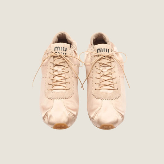 Miu Miu Plume satin sneaker in powder pink, top view — The Quiet Edition