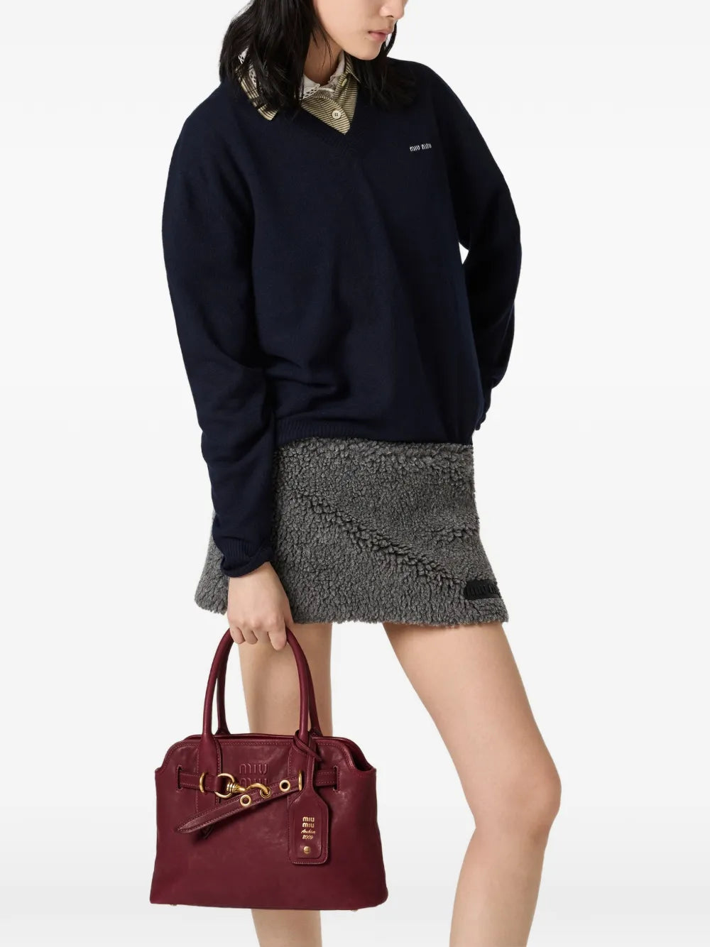 Miu Miu Wool and Cashmere Sweater in blue on a model, styled with a grey mini skirt and red bag
