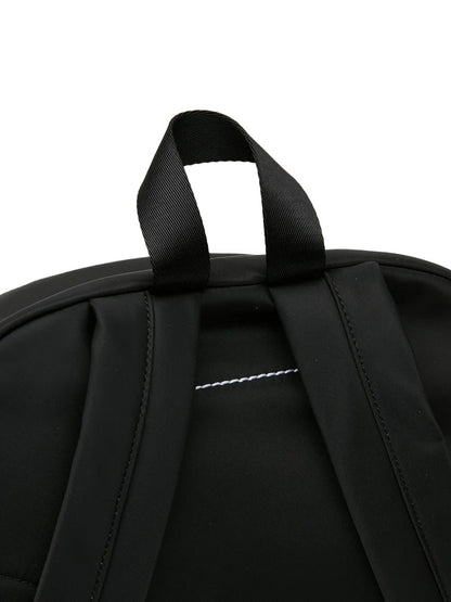 MM6 Maison Margiela Numbers-Patch Backpack in Black, angle — The Quiet Edition