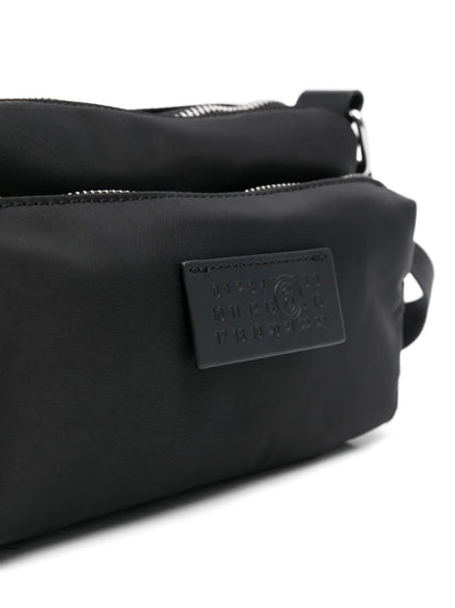 MM6 Maison Margiela Numbers-patch cross body bag in black, patch detail — The Quiet Edition