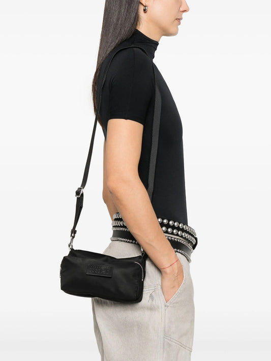 MM6 Maison Margiela Numbers-patch cross body bag in black, model crossbody view — The Quiet Edition