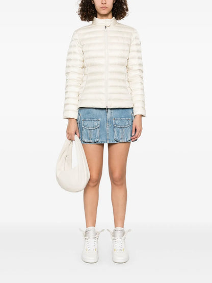 Moncler Igelle Quilted Down Jacket in white, worn full-length view | The Quiet Edition