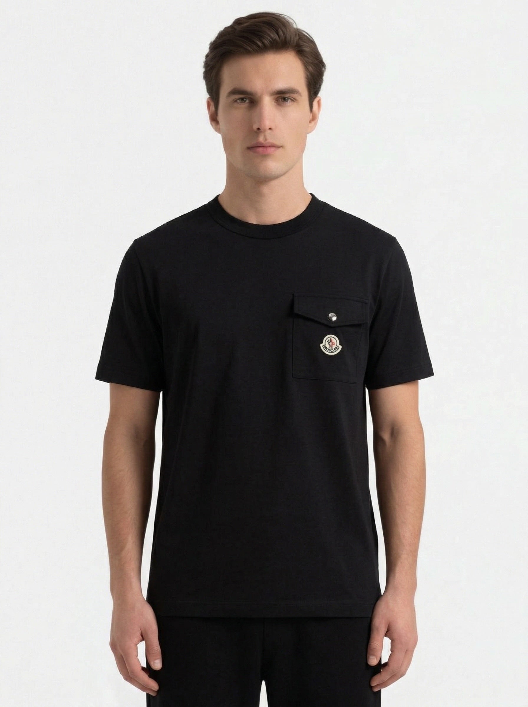 Moncler logo patch pocket t-shirt in black, model front — The Quiet Edition