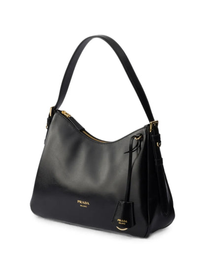 Prada Aimée Medium Leather Shoulder Bag in Black, side — The Quiet Edition