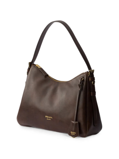 Prada Aimée Medium Leather Shoulder Bag in Brown, angle — The Quiet Edition