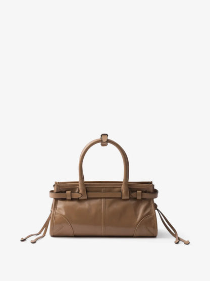 Prada Bonnie mini handbag in tan leather, back view showing plain rear panel and belt strap