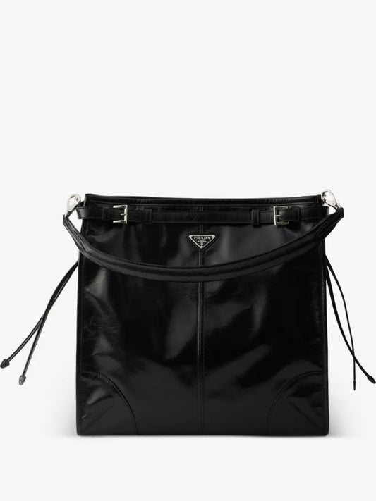Prada Bonnie Leather Shoulder Bag in Black, front view with handle — The Quiet Edition