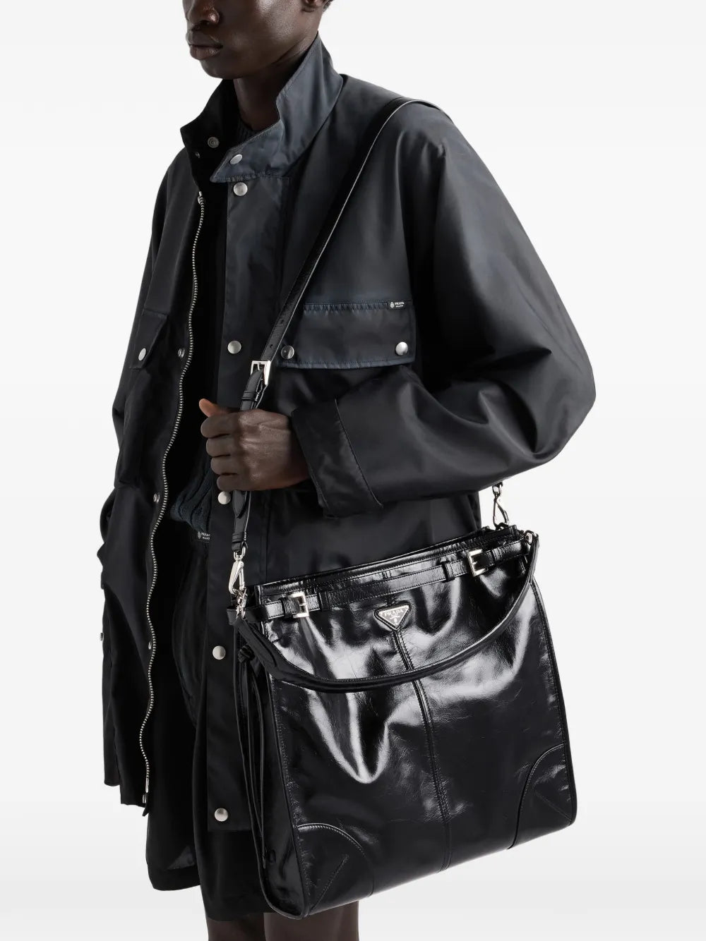 Prada Bonnie Leather Shoulder Bag in Black, worn on the shoulder view — The Quiet Edition